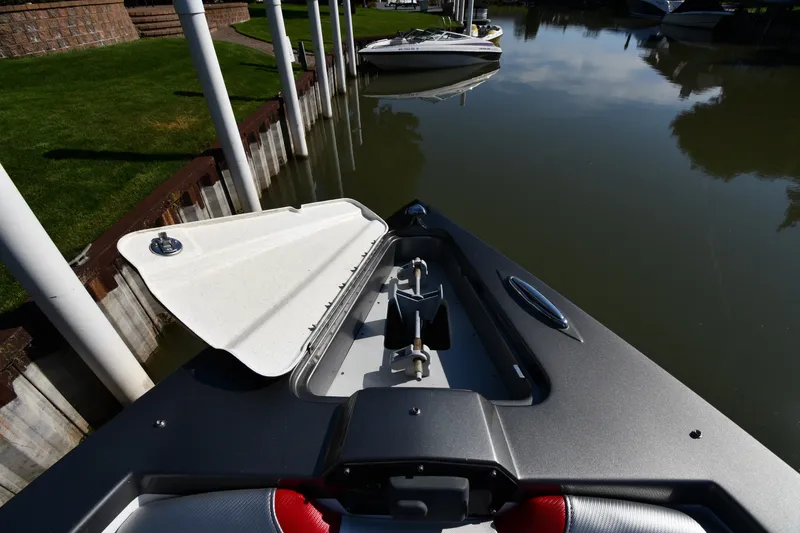 Slide: The Image of 2017 Sunsation 32 CCX boat docked, open hatch, calm water reflection. - 7