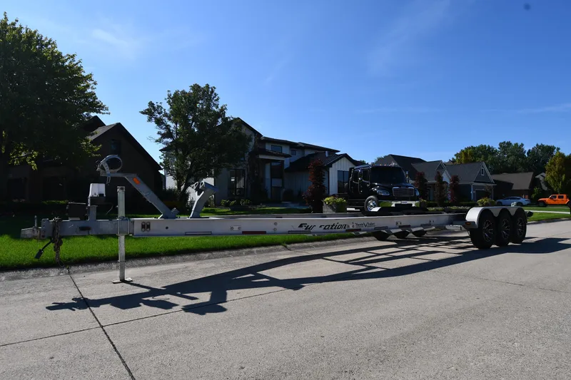 Slide: The Image of Trailer for 2017 Sunsation 32 CCX boat parked on suburban street. - 36