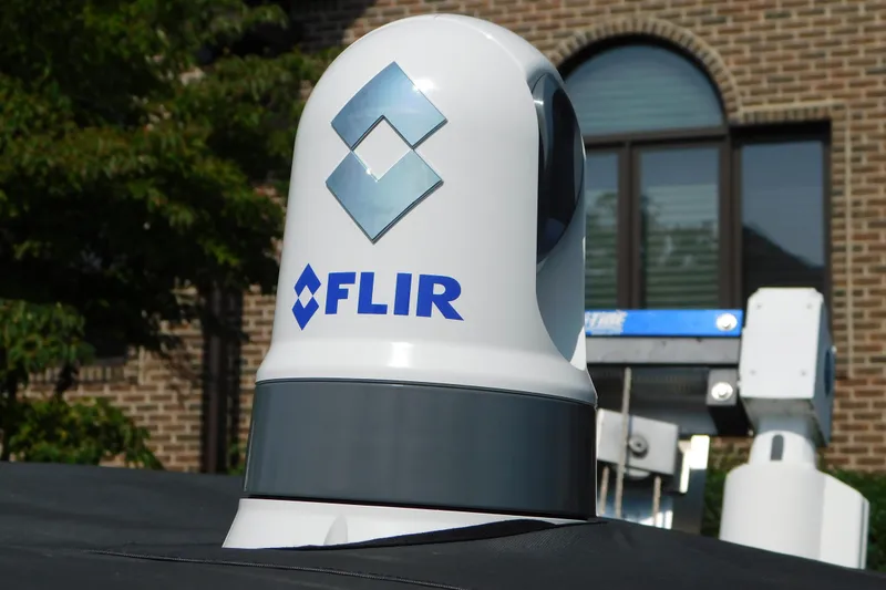 Slide: The Image of FLIR camera on 2017 Sunsation 32 CCX boat, brick building background. - 26