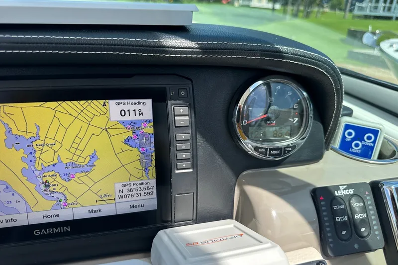 Slide: The Image of Dashboard of 2021 Crownline Eclipse E305 XS with Garmin GPS and RPM gauge. - 26