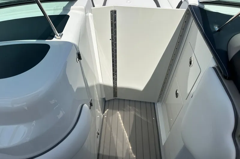 Slide: The Image of 2021 Crownline Eclipse E305 XS boat interior with sleek design and storage compartments. - 31