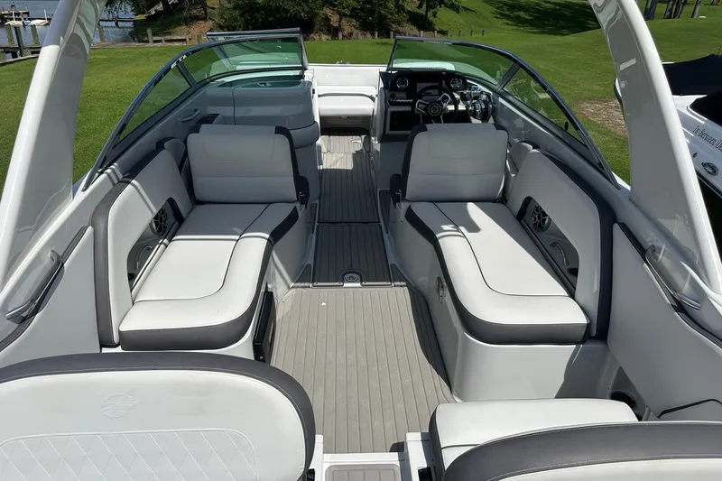 Slide: The Image of 2021 Crownline Eclipse E305 XS boat interior with spacious seating and modern design. - 17