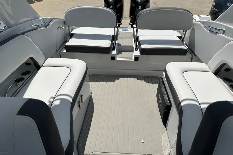 Slide: The Image of 2021 Crownline Eclipse E305 XS boat interior with spacious seating and modern design. - 16