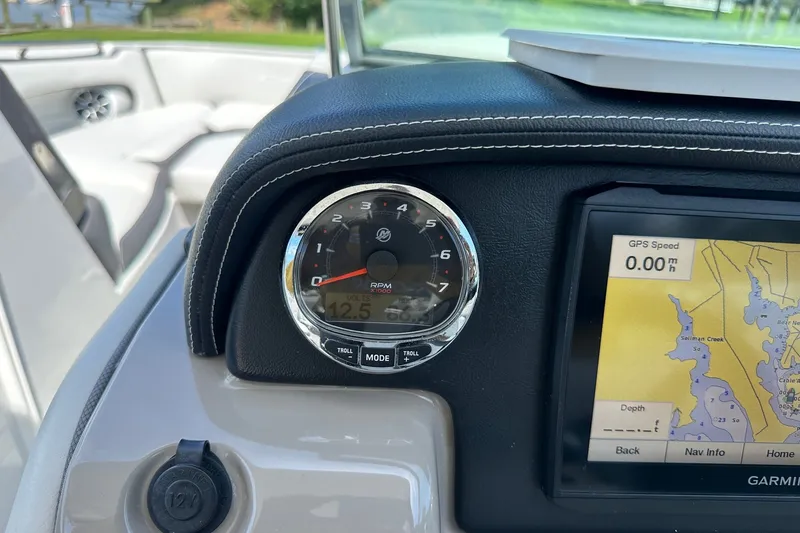 Slide: The Image of Dashboard of 2021 Crownline Eclipse E305 XS with RPM gauge and GPS display. - 25