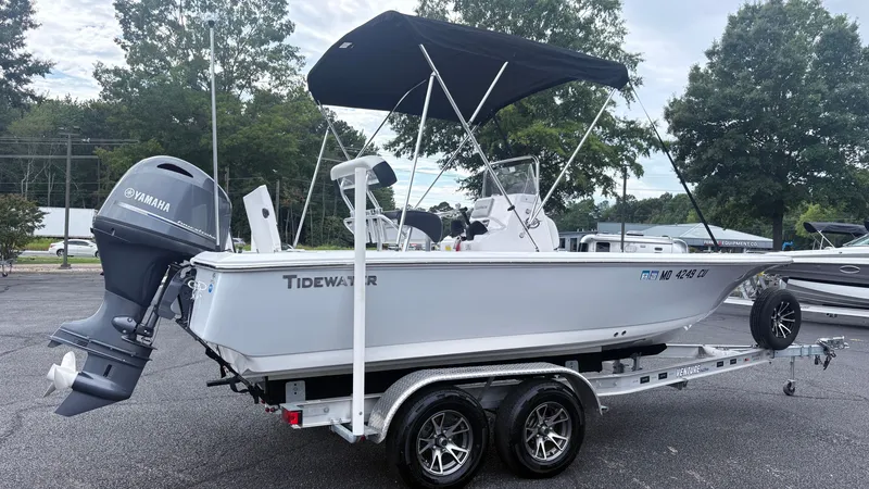Slide: The Image of A 2024 Tidewater 1910 Bay Max boat on a trailer with a Yamaha outboard motor. - 2