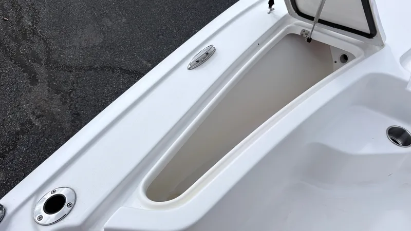 Slide: The Image of The image shows an open storage compartment on a boat, surrounded by white surfaces. - 14