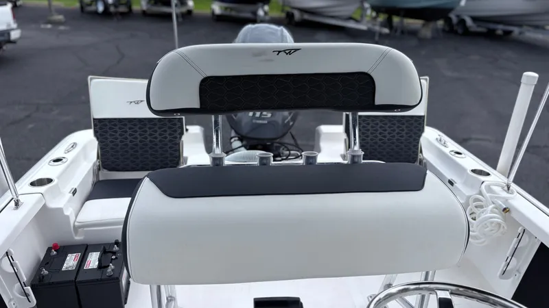 Slide: The Image of The image shows the cockpit of a 2024 Tidewater 1910 Bay Max boat with modern seating and controls. - 8