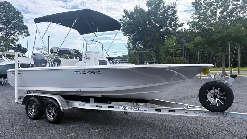 Slide: The Image of A 2024 Tidewater 1910 Bay Max on a trailer with a black sunshade. - 3
