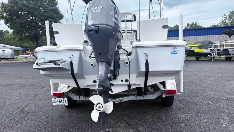 Slide: The Image of The image shows the rear of a 2024 Tidewater 1910 Bay Max boat with an outboard motor. - 5