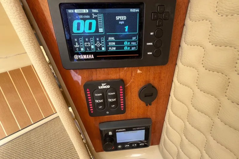 Slide: The Image of Control panel of 2019 Chris-Craft Launch GT 28 with Yamaha display and Lenco controls. - 24