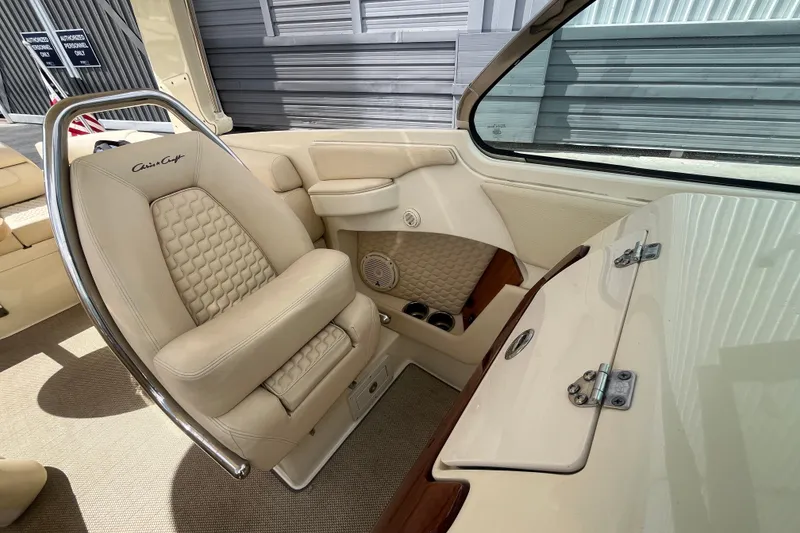 Slide: The Image of Luxurious interior of 2019 Chris-Craft Launch GT 28 boat with beige seating. - 16