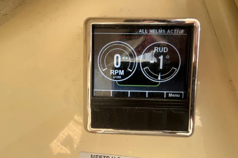 Slide: The Image of Digital display on 2019 Chris-Craft Launch GT 28 showing RPM and rudder angle. - 25