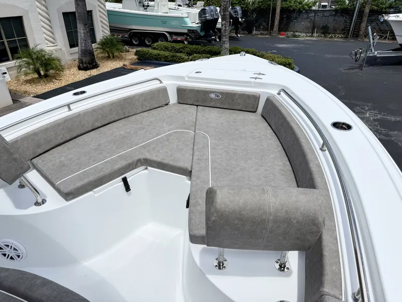 Slide: The Image of The image shows the bow area of a Sea Hunt Ultra 229 boat with gray upholstery. - 28
