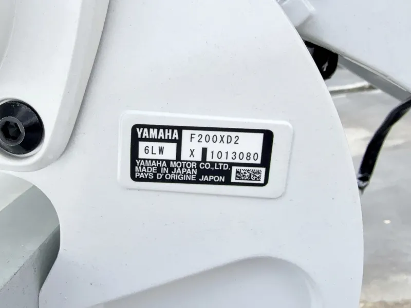 Slide: The Image of Close-up of a Yamaha engine label showing model and serial number. - 31