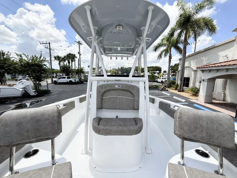 Slide: The Image of The image shows the cockpit of a 2027 Sea Hunt Ultra 229 boat with gray seating. - 23