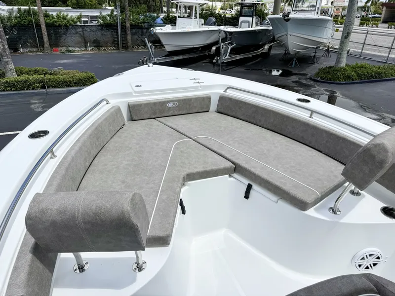 Slide: The Image of The image shows the bow area of a Sea Hunt Ultra 229 boat with gray cushions. - 27