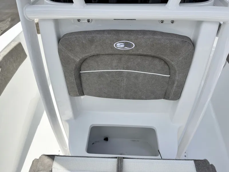 Slide: The Image of The image shows the interior of a Sea Hunt Ultra 229 boat with gray upholstery. - 24