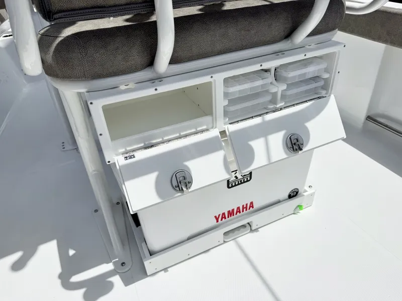 Slide: The Image of The image shows a white storage area on a boat with Yamaha logo and seat cushions. - 14