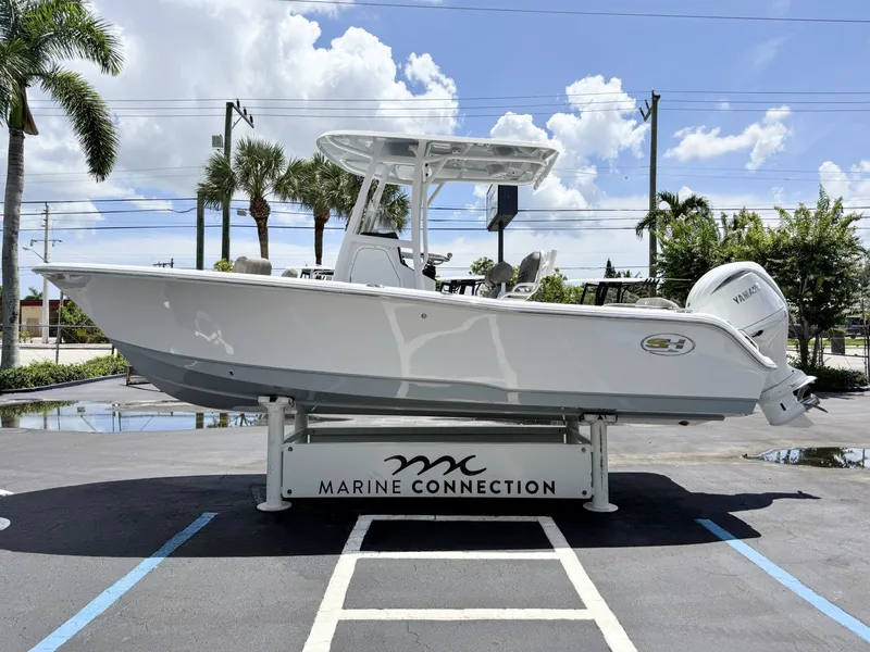 Slide: The Image of A 2027 Sea Hunt Ultra 229 boat is displayed on an outdoor stand. - 5