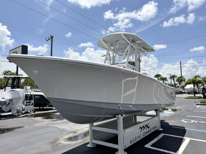 Slide: The Image of A 2027 Sea Hunt Ultra 229 boat is parked on a lot. It features a sleek design. - 4