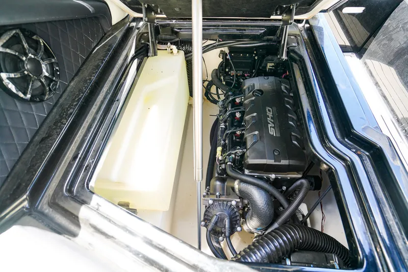 Slide: The Image of Engine compartment of 2025 Yamaha Boats 275SD, showcasing powerful motor and components. - 26