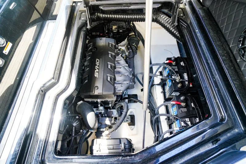Slide: The Image of 2025 Yamaha Boats 275SD engine compartment with SVHO engine and batteries. - 25