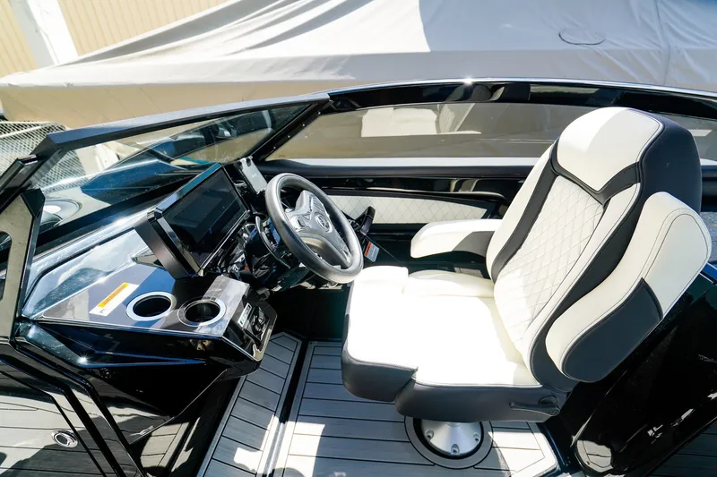 Slide: The Image of 2025 Yamaha Boats 275SD cockpit with modern steering and luxurious seating. - 17