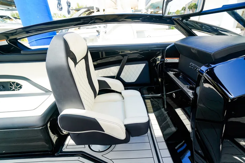 Slide: The Image of 2025 Yamaha Boats 275SD interior with sleek black and white seating design. - 14