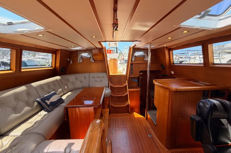 Slide: The Image of Luxurious interior of a 2003 Farr 50 Pilot House yacht with elegant wood finishes. - 95