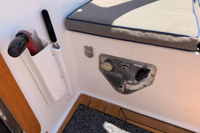 Slide: The Image of Interior of 2003 Farr 50 Pilot House with Navtec panel and cushioned seating. - 51