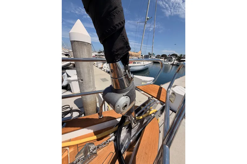 Slide: The Image of 2003 Farr 50 Pilot House yacht detail at marina, showcasing deck and rigging. - 28