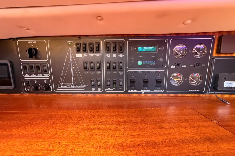 Slide: The Image of Control panel of a 2003 Farr 50 Pilot House yacht with switches and gauges. - 67