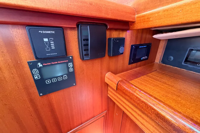 Slide: The Image of Control panel of a 2003 Farr 50 Pilot House yacht with various monitoring systems. - 65