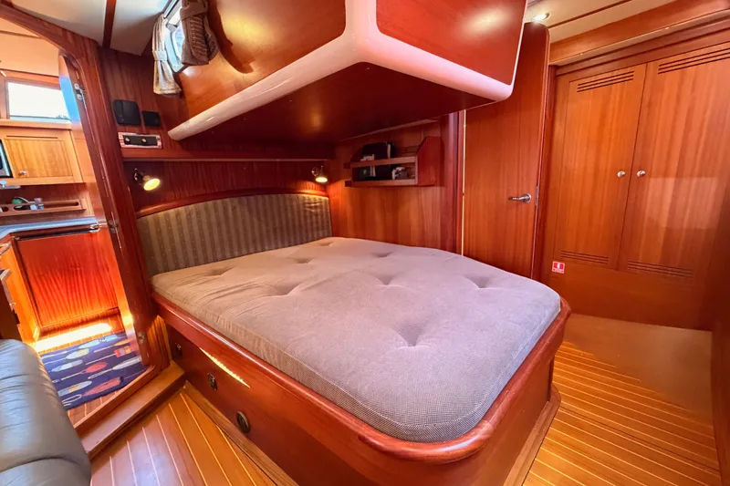 Slide: The Image of Luxurious cabin interior of 2003 Farr 50 Pilot House yacht with wooden finishes. - 109