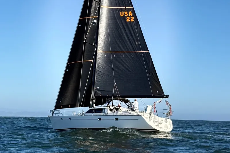 Slide: The Image of Sailing yacht Farr 50 Pilot House 2003 on open sea with black sails. - 3