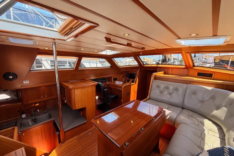 Slide: The Image of Luxurious interior of a 2003 Farr 50 Pilot House yacht with elegant wood finishes. - 61