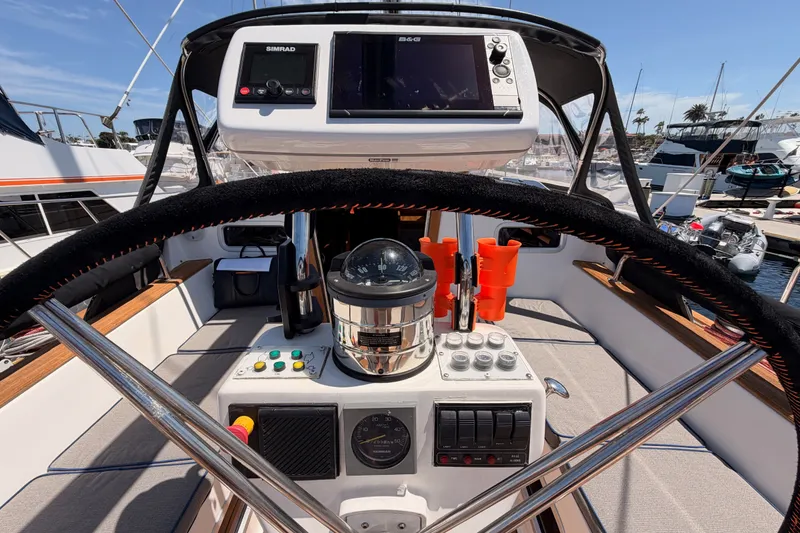Slide: The Image of Steering wheel and navigation equipment on a 2003 Farr 50 Pilot House yacht. - 45
