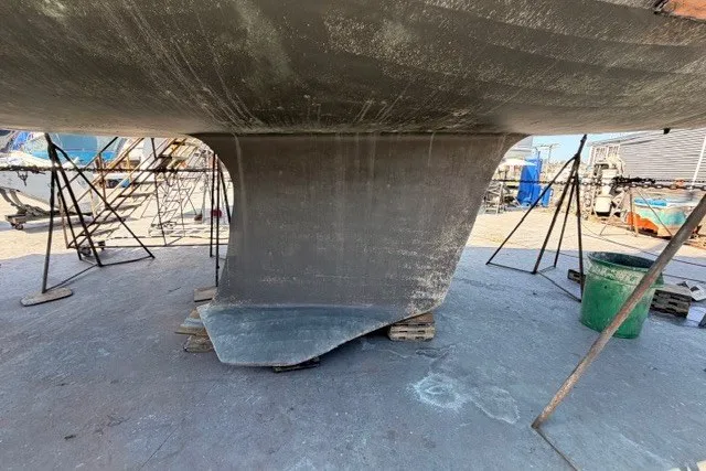 Slide: The Image of Keel of a 2003 Farr 50 Pilot House sailboat on dry dock. - 145