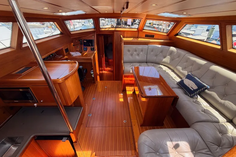 Slide: The Image of Luxurious interior of a 2003 Farr 50 Pilot House yacht with elegant wood finishes. - 54