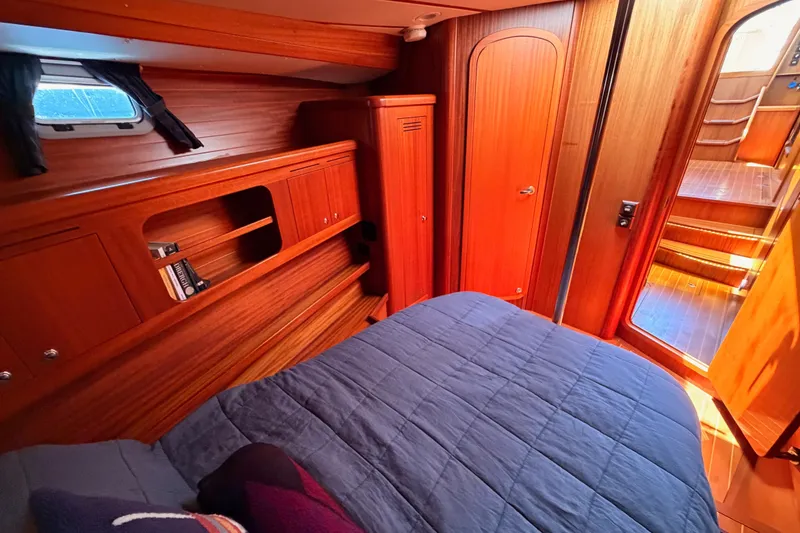 Slide: The Image of Cozy cabin interior of 2003 Farr 50 Pilot House yacht with wooden furnishings. - 88