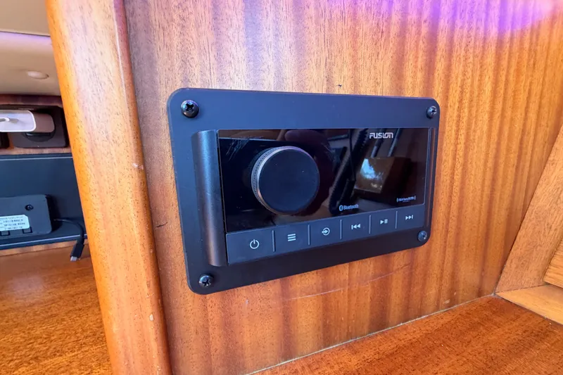 Slide: The Image of Audio control panel on 2003 Farr 50 Pilot House yacht, featuring Bluetooth connectivity. - 69
