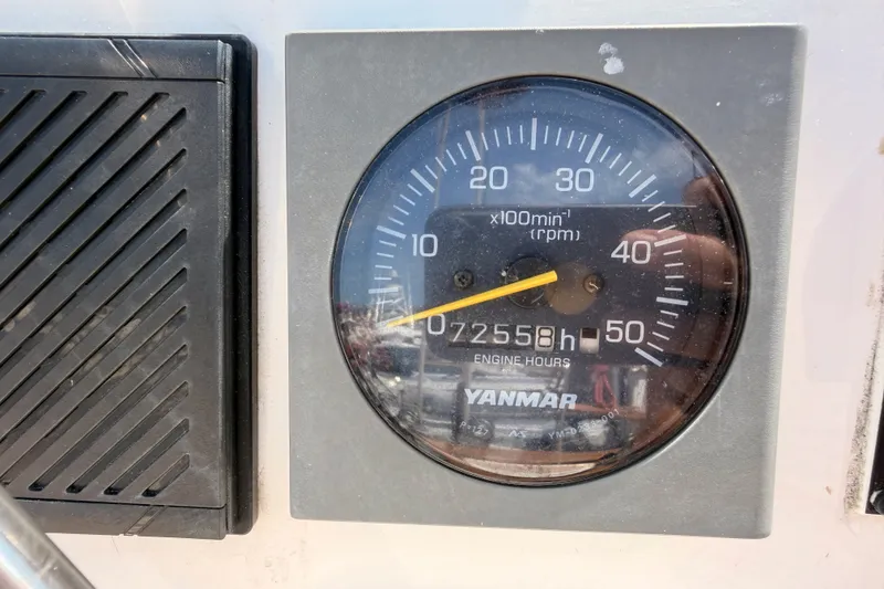 Slide: The Image of Tachometer of 2003 Farr 50 Pilot House showing 7255.8 engine hours, Yanmar branding visible. - 125