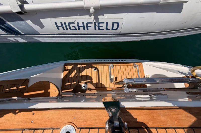Slide: The Image of Top view of 2003 Farr 50 Pilot House yacht deck beside Highfield inflatable boat. - 40