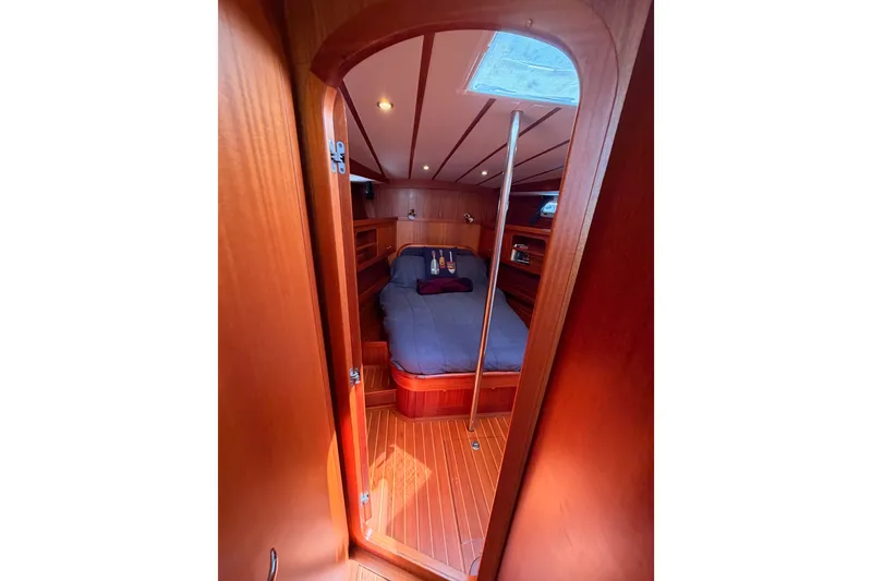 Slide: The Image of Cozy cabin interior of 2003 Farr 50 Pilot House yacht with wooden finish. - 82