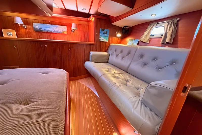 Slide: The Image of Luxurious interior of 2003 Farr 50 Pilot House yacht with plush seating and elegant wood finish. - 107