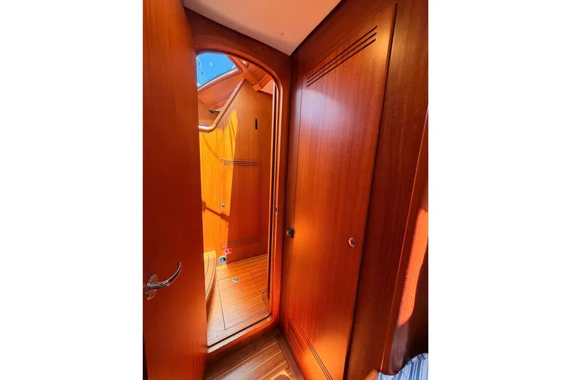 Slide: The Image of Interior view of 2003 Farr 50 Pilot House, showcasing wooden cabin details. - 78