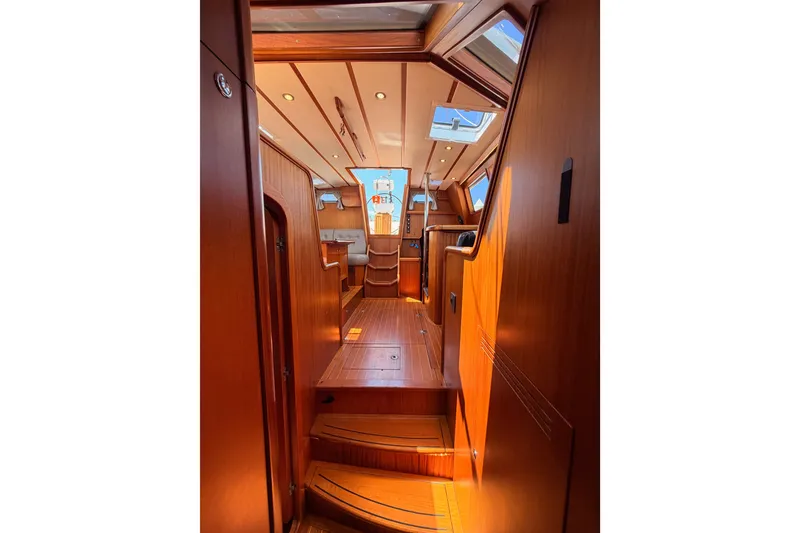 Slide: The Image of Interior of 2003 Farr 50 Pilot House yacht with wooden finishes and skylights. - 94