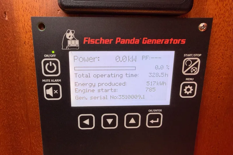 Slide: The Image of Fischer Panda generator display on 2003 Farr 50 Pilot House, showing power and operating stats. - 126