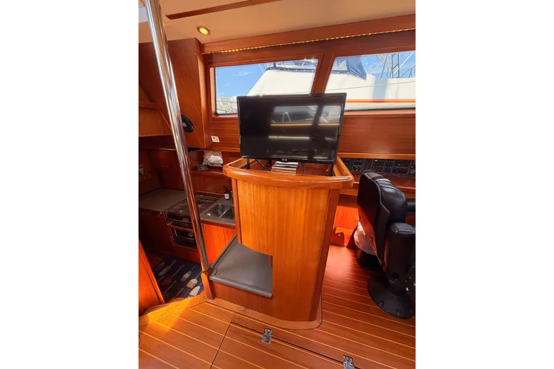 Slide: The Image of Interior of 2003 Farr 50 Pilot House yacht with wood finish and modern amenities. - 63
