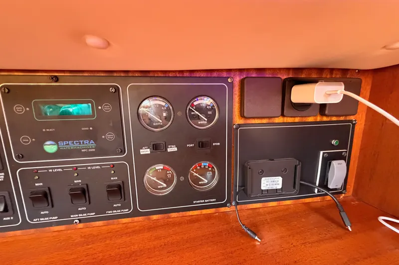 Slide: The Image of Control panel of a 2003 Farr 50 Pilot House yacht with gauges and switches. - 68